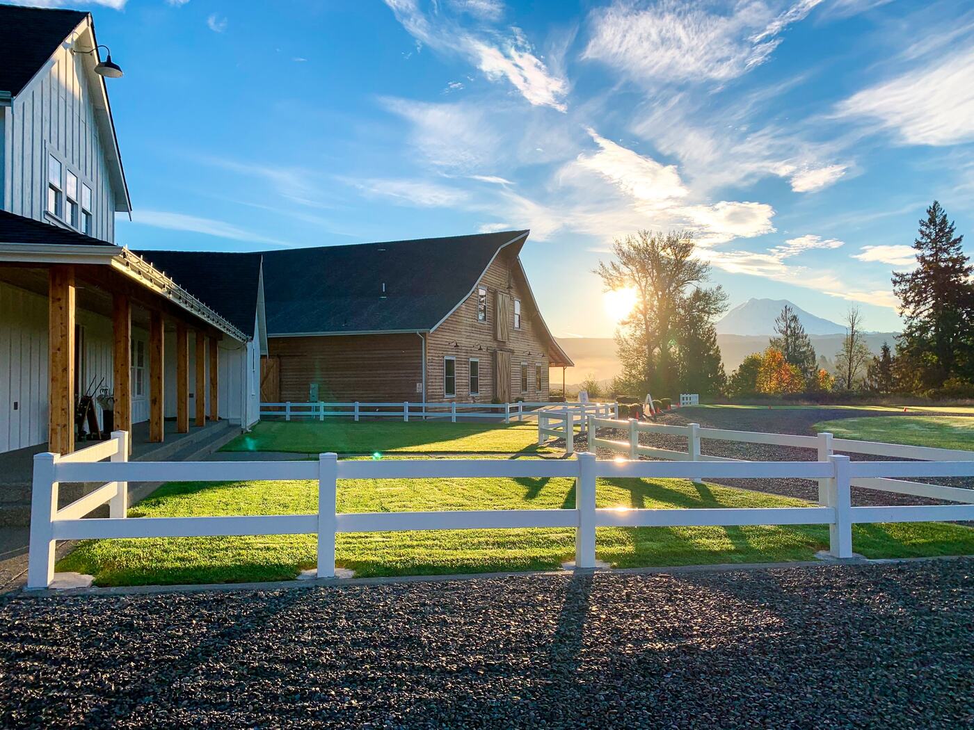 Sunrise over the bridal cottage, cedar barn, and Mount Rainier