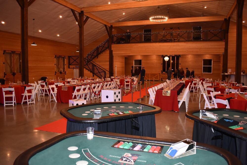 Blackjack tables set in the barn with the loft and string-lit staircase