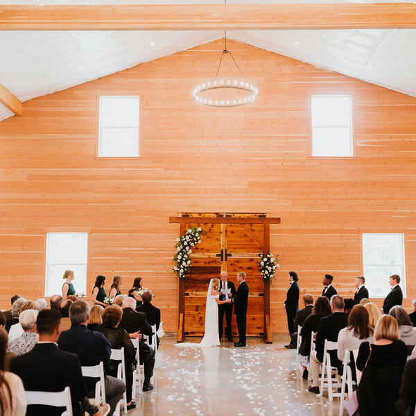 Indoors in the Barn: Ceremony under the crystal chandelier