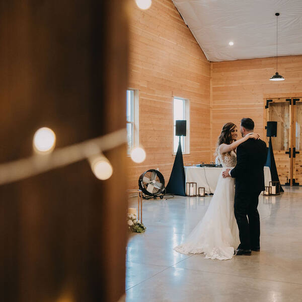 First dance framed by a string-lit post