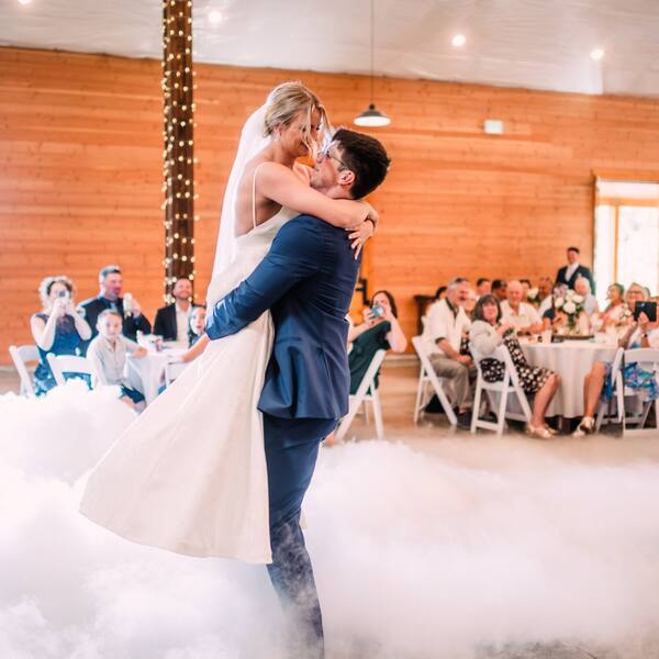 First dance lift on a cloud of low fog, by More Than Just Music