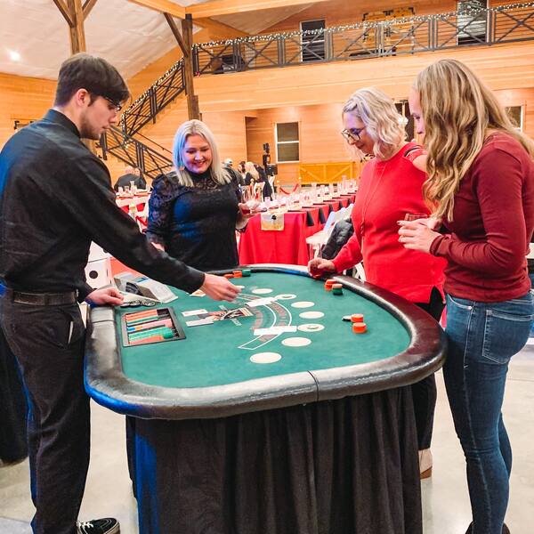 Casino-night holiday party: guests at the blackjack table