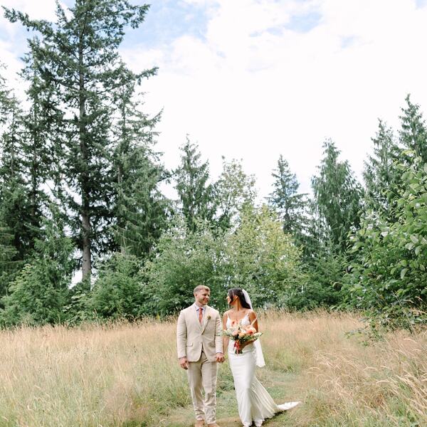 Couple on the mowed path along the tree line