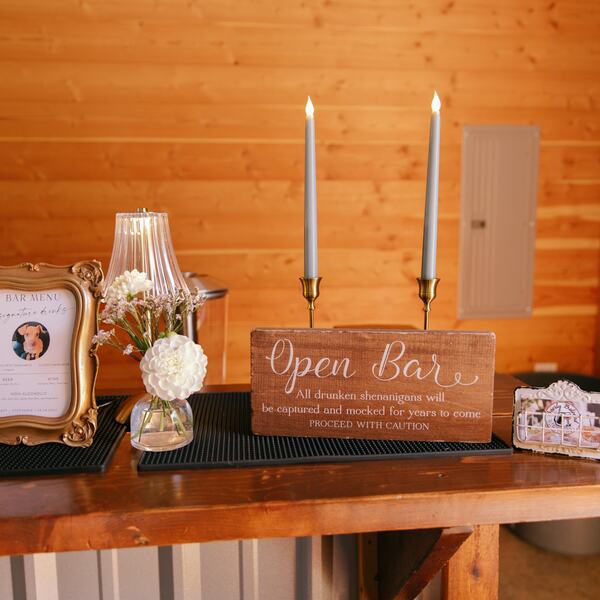 Open bar sign and signature drink menu on the cedar bar