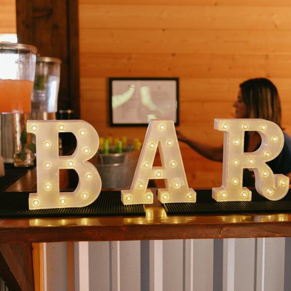 Marquee BAR letters on the cedar bar top