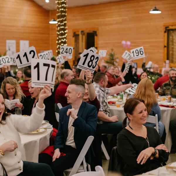 Live auction paddle raise at the fundraiser