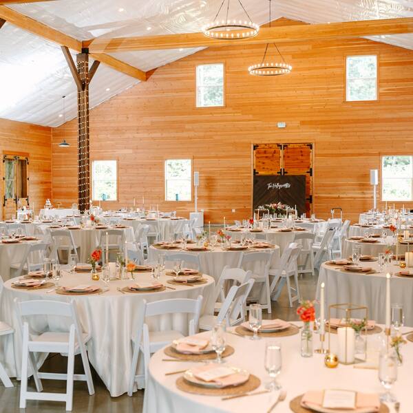 Tables set under three chandeliers