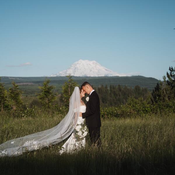 Couple in the meadow with Rainier