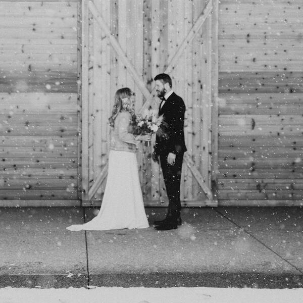 Falling snow at the barn doors